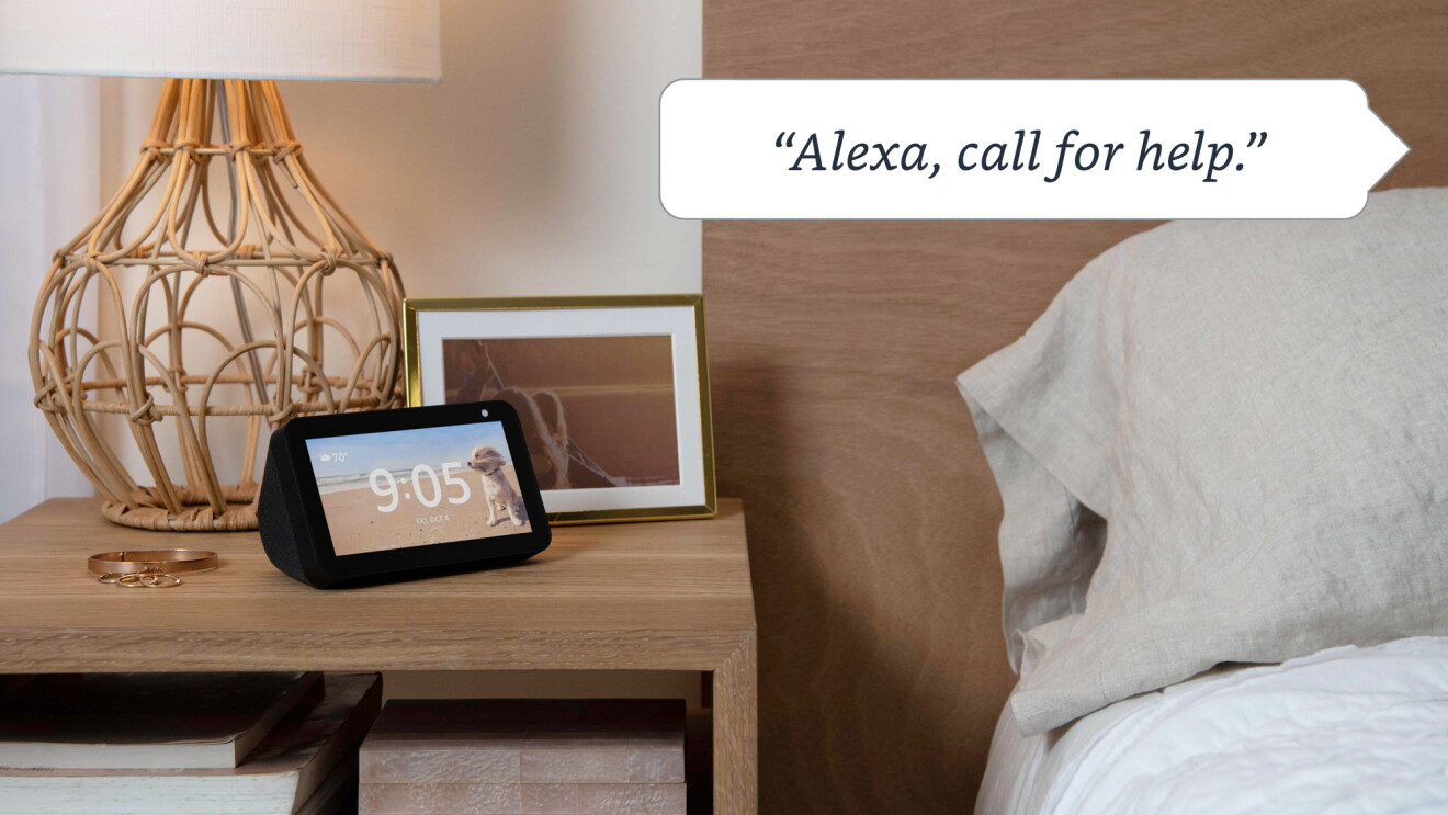 An image of a black Echo Show sitting on a nightstand and a text box at the top that reads "Alexa, call for help."
