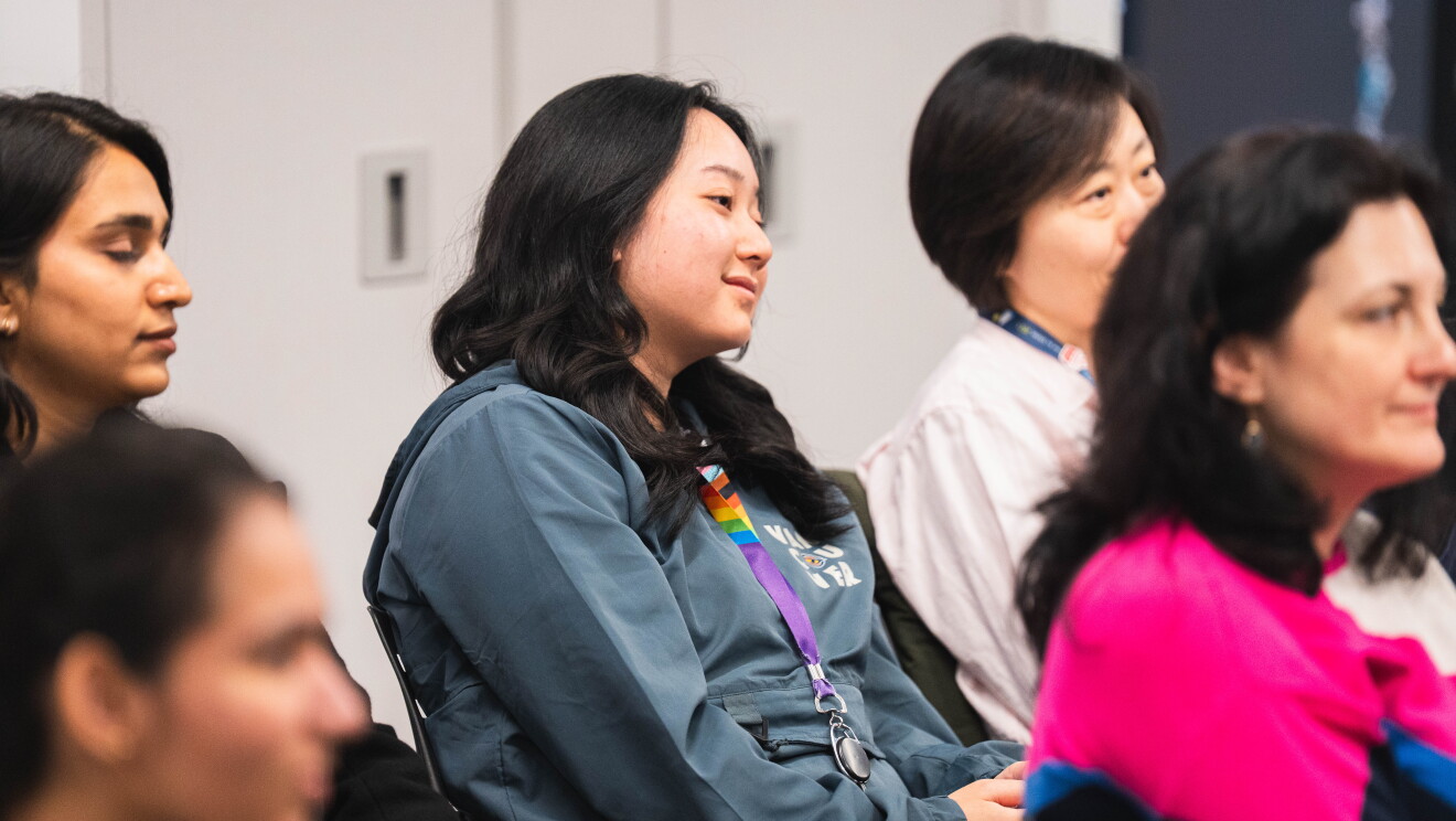 women speaking at event 