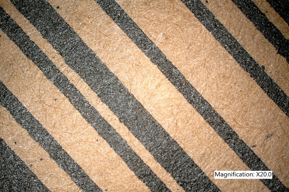 20x magnified view of a barcode from a recycled mailer.