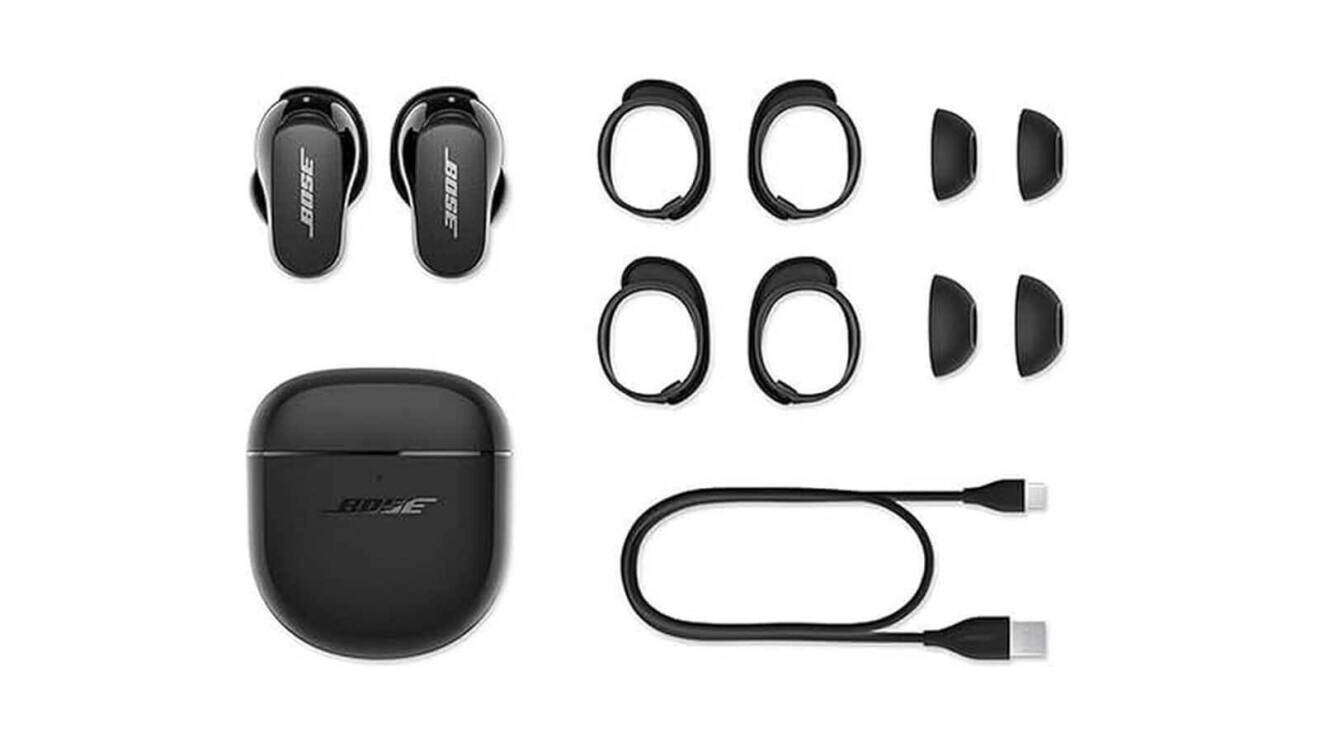 An image of the Bose, Quietcomfort earbuds with their case and multiple attachments to comfortably fit your ears, as well as a charging cord.