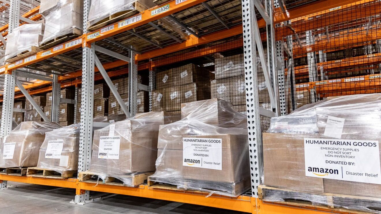 Amazon Wildfire Relief Hub: Amazon-donated humanitarian goods stacked on warehouse shelves