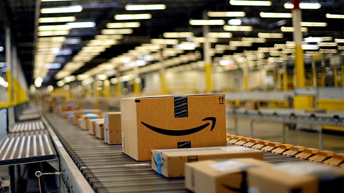 Boxes on a conveyor belt at a fulfillment center in Tracy, CA.