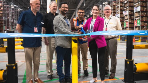 Amazon employees cutting ribbon