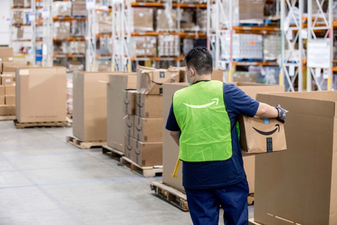 An Amazon employee readies product to be used for disaster relief.