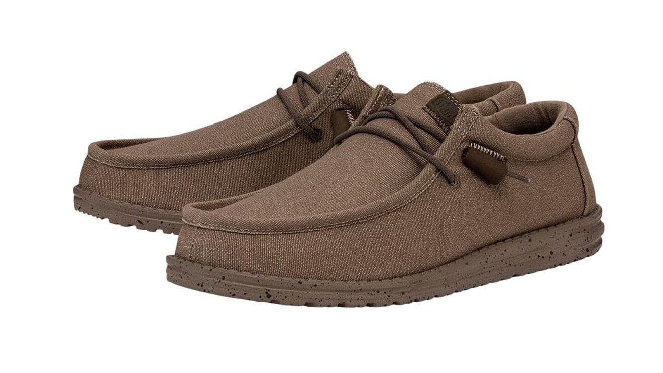 An image of a pair of brown, loafer shoes for men with two darker brown shoelaces at the top.