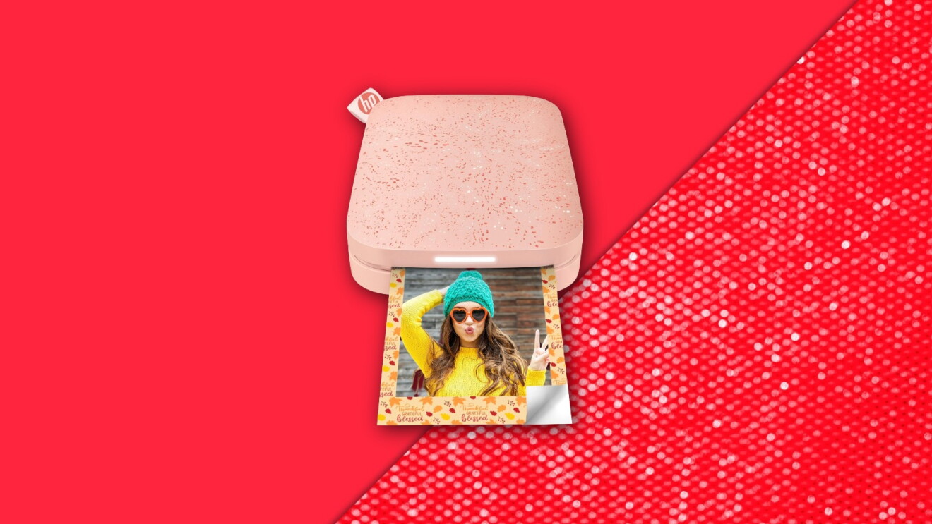 Portable photo printer with colorful image emerging