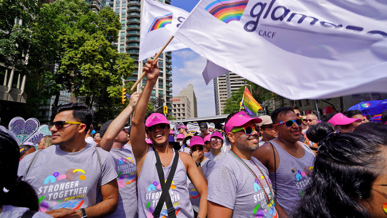 A photo of people walking in the 2022 Amazon Toronto Pride parade.