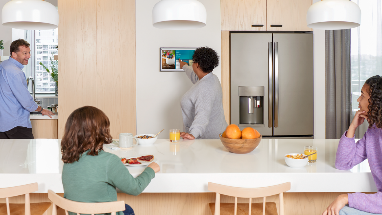 An image of a family eating breakfast in their kitchen.