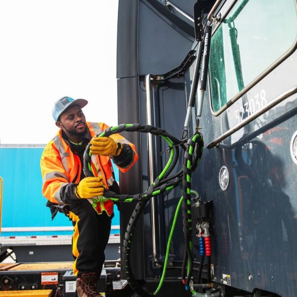 portraits and environmental photos of abel tuyisenge, a transportation operations management associate at amazon, as he drives and inspects trucks