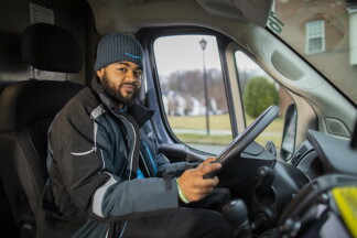 Delivery Associate Sitting Inside Van 