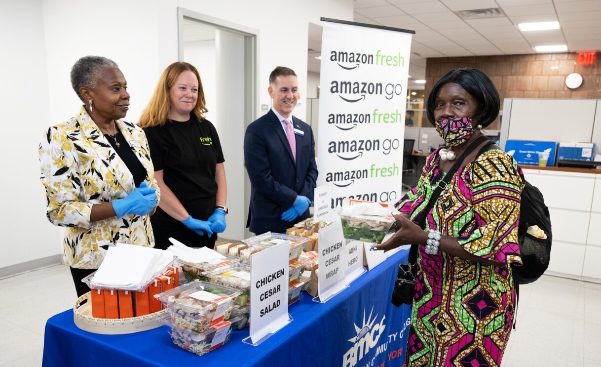 An image of people standing at a booth