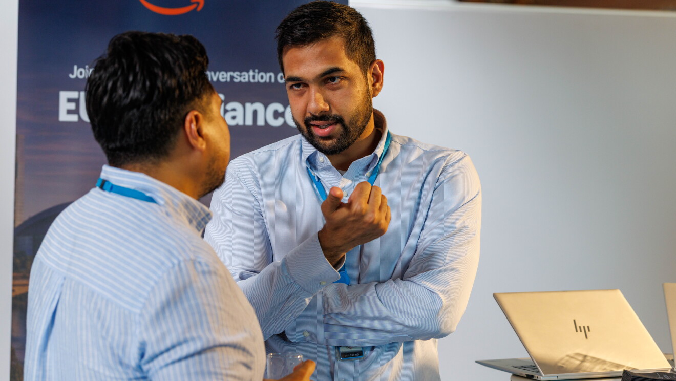 People talking to each other at a business event. 