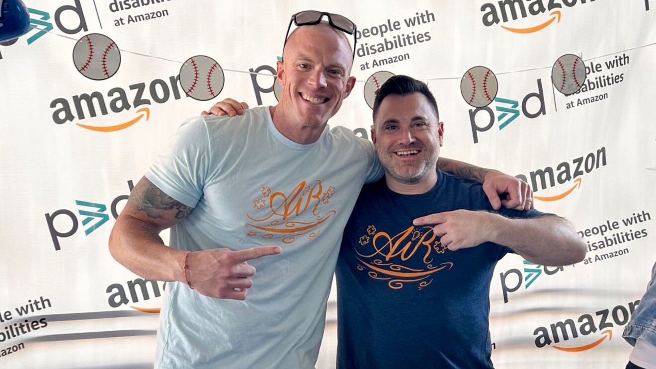 Josh poses for a picture with a colleague at an Amazon-sponsored event.