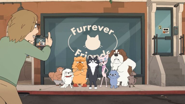 Cartoon man photographing a group of cartoon animals, including cats, dogs a beaver and a mouse outside a pet rescue called Furrever Friends