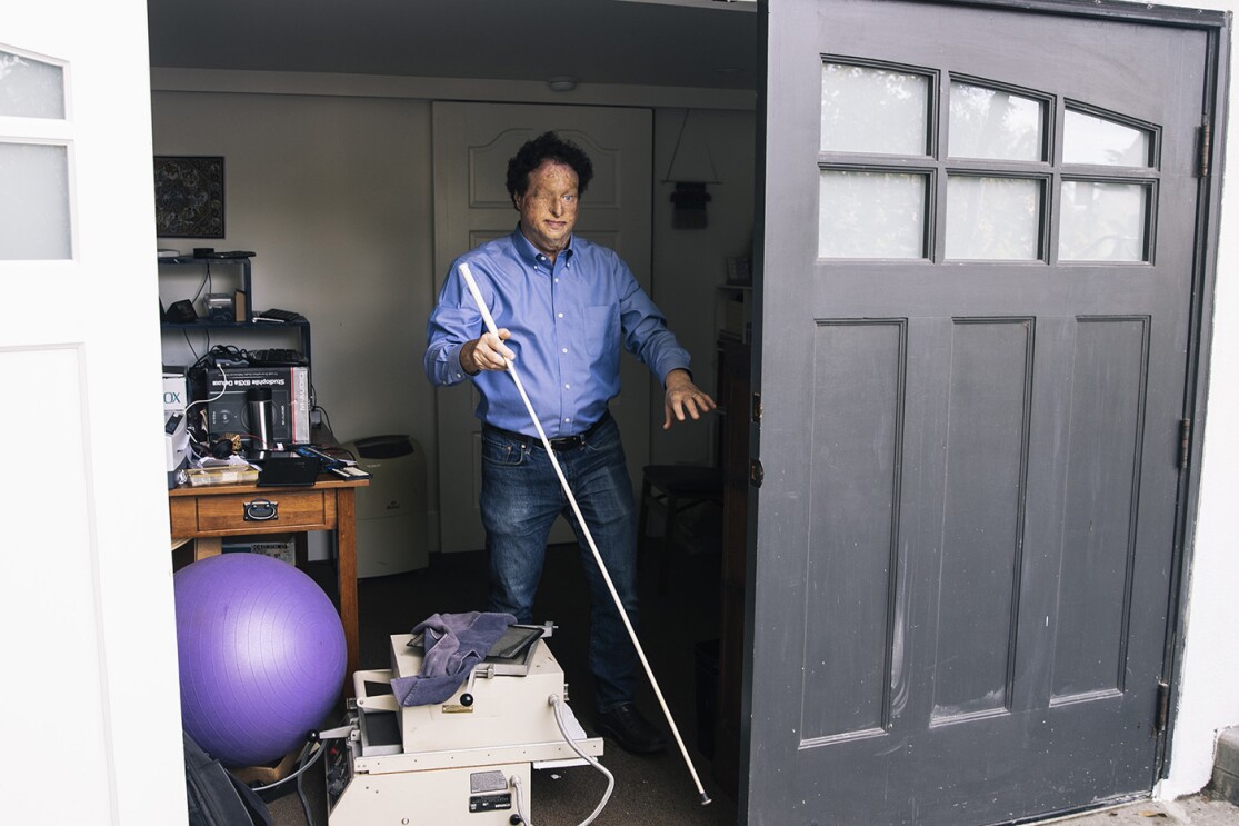 Josh Miele, Principle Accessibility Researcher at Amazon Lab126, exits his home office.