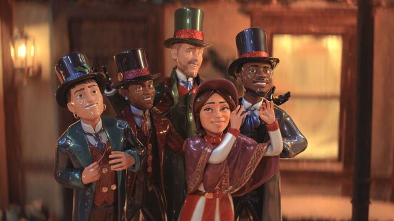 An image of several caroler figurines. They are a mix of women and men carolers dressed in hats and clothing from decades ago.