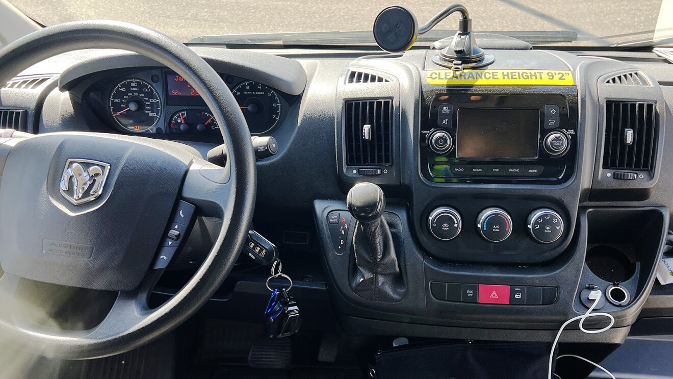 The dashboard of inside an Amazon delivery vehicle.