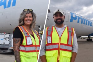 A split image. The image on the left shows a woman standing in front of a Prime Air plane smiling for a photo while wearing a safety vest. The image on the left shows a man smiling for a photo while wearing a safety vest in front of a Prime Air plan.