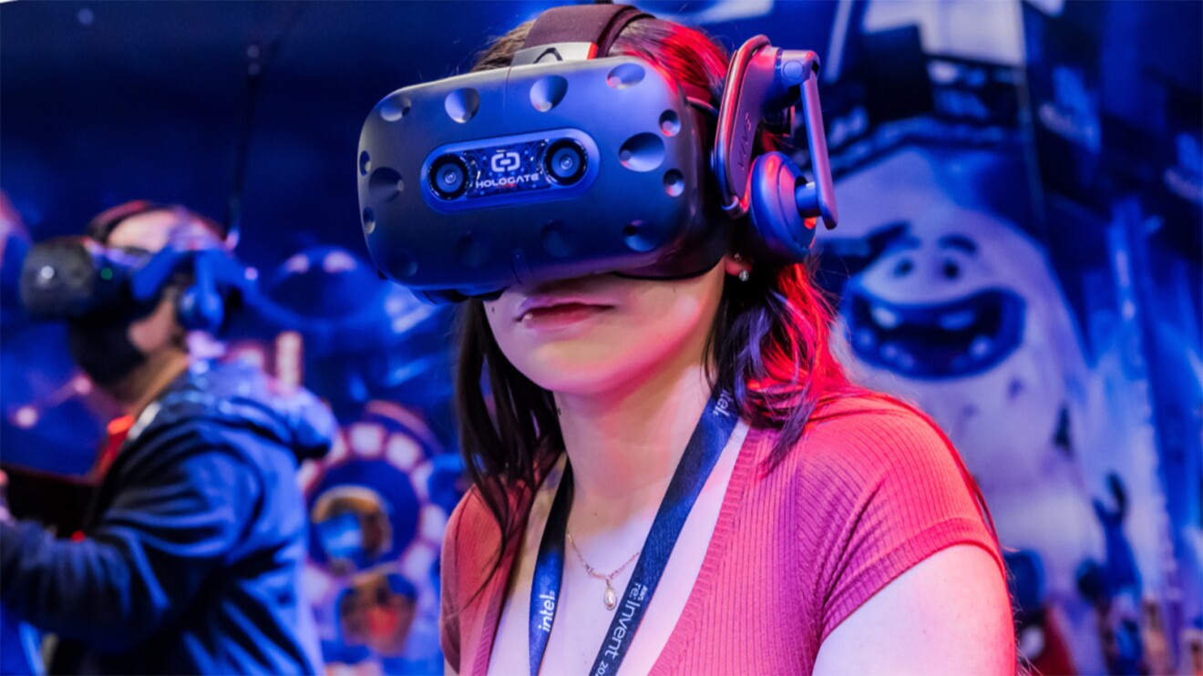 A photo of a conference attendee wearing a virtual reality headset.