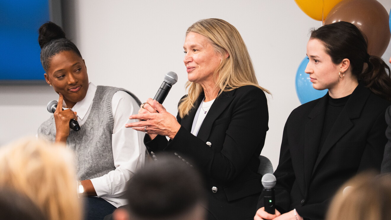 women speaking at event 