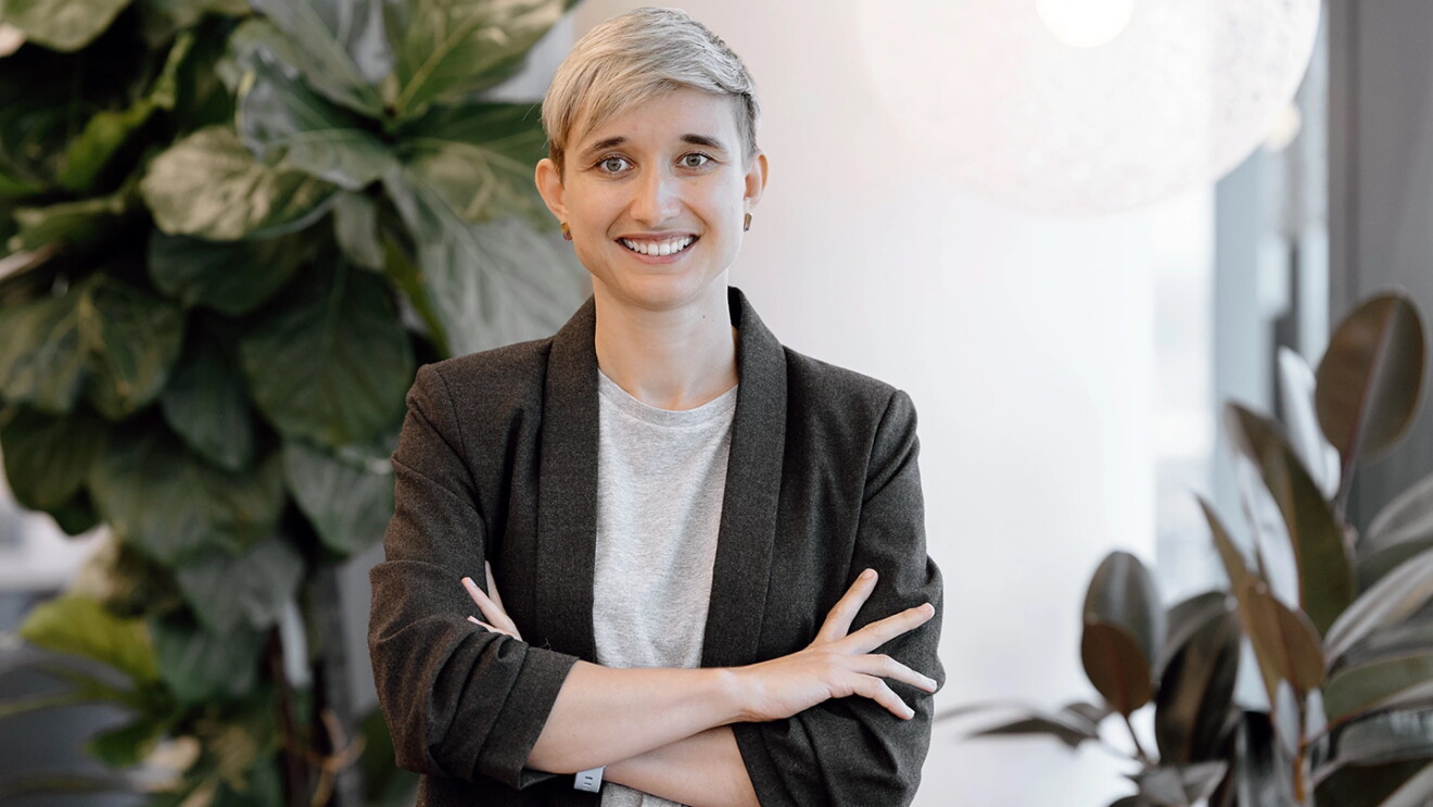 Olga Moskvyak, Applied Scientist crossing her arm, standing at BNE12