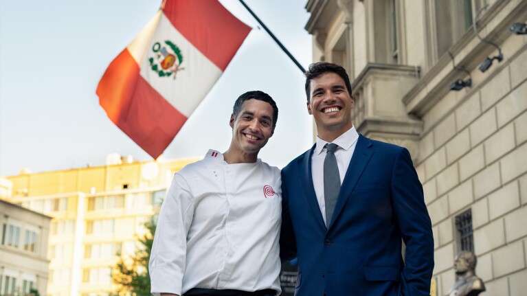 An image of two brothers smiling for a photo.