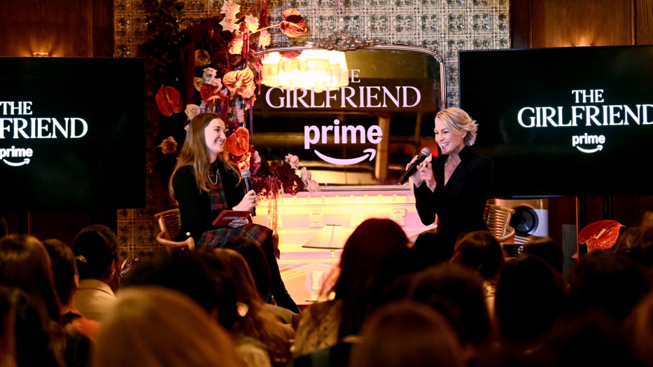 Two women on stage at 'The Girlfriend' Prime event with audience