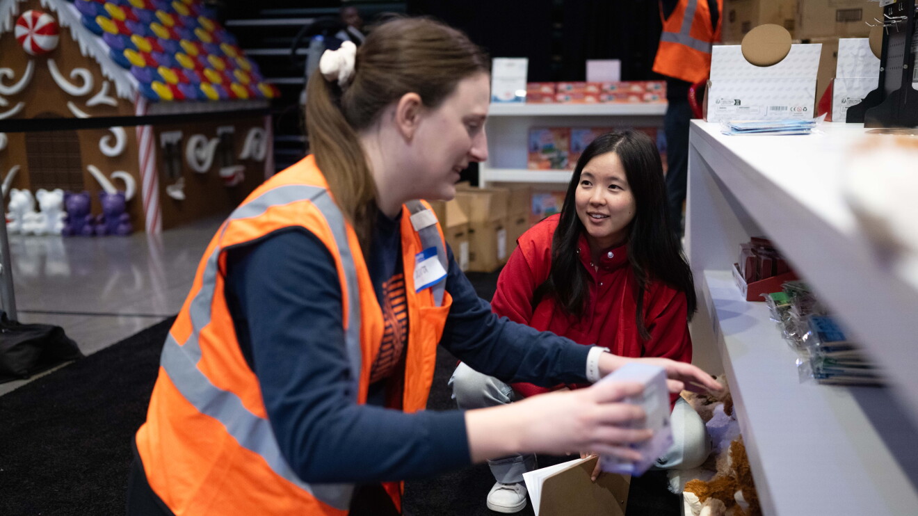 Amazon’s Winter Wonderland: girl looking at working prepping for winter event