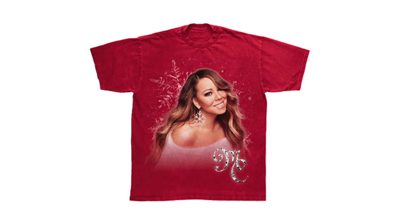 An image of a red tee shirt with Mariah Carey on the front. Below her image is lettering that says "MC"