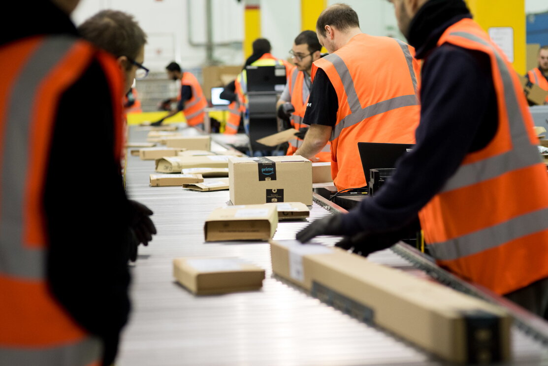 Amazon Fulfillment Center employees working 