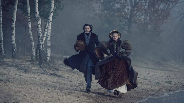 Victorian-era couple strolling through misty forest path