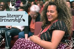 A photo of an event attendee sitting in a theater. The Amazon Literary Partnership logo overlays the photo.