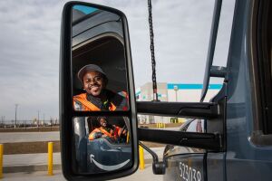 portraits and environmental photos of abel tuyisenge, a transportation operations management associate at amazon, as he drives and inspects trucks