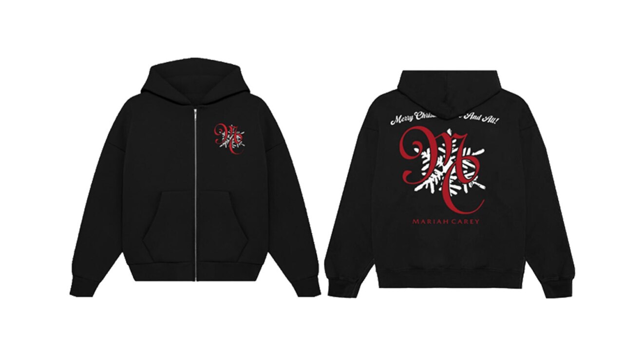 An image of a black zip-upd hoodie that says "MC" in red lettering on the back. It also has the same logo but smaller on the front on the left chest side of the jacket.