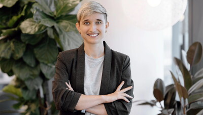 Olga Moskvyak, Applied Scientist crossing her arm, standing at BNE12