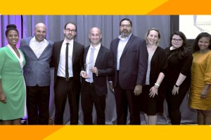 The Amazon legal team smiles with their award.