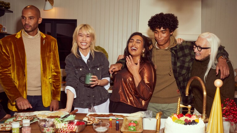 An image of people gathered in a home making Christmas cookies.