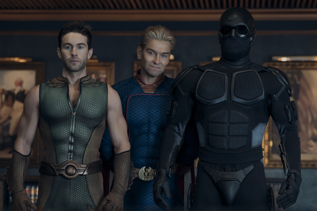 Three super heroes standing