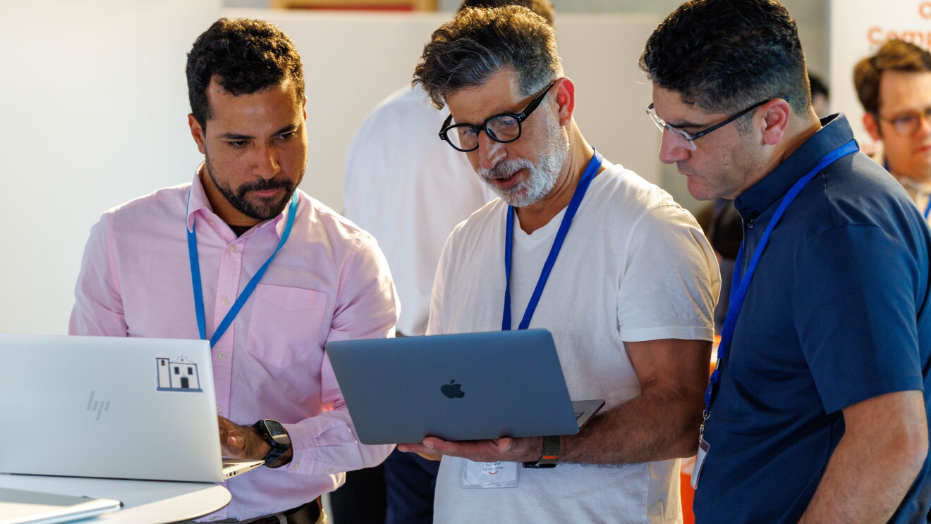 People talking to each other at a business event. 
