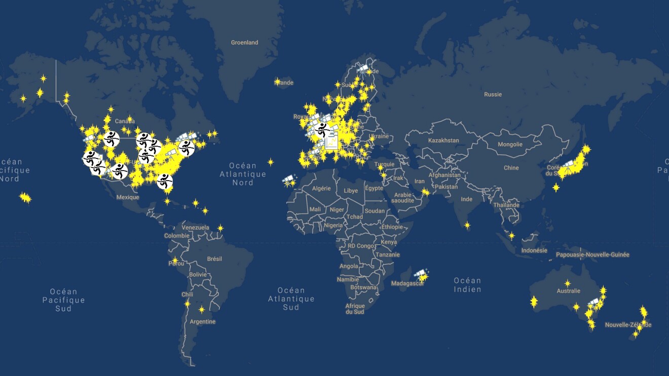 An illustrated image of a map showing lit up spots in various spots around the world.