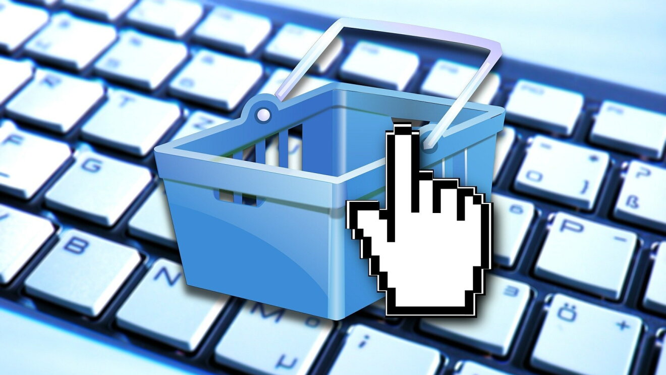 An image of a shopping cart on a keyboard depicting e-commerce
