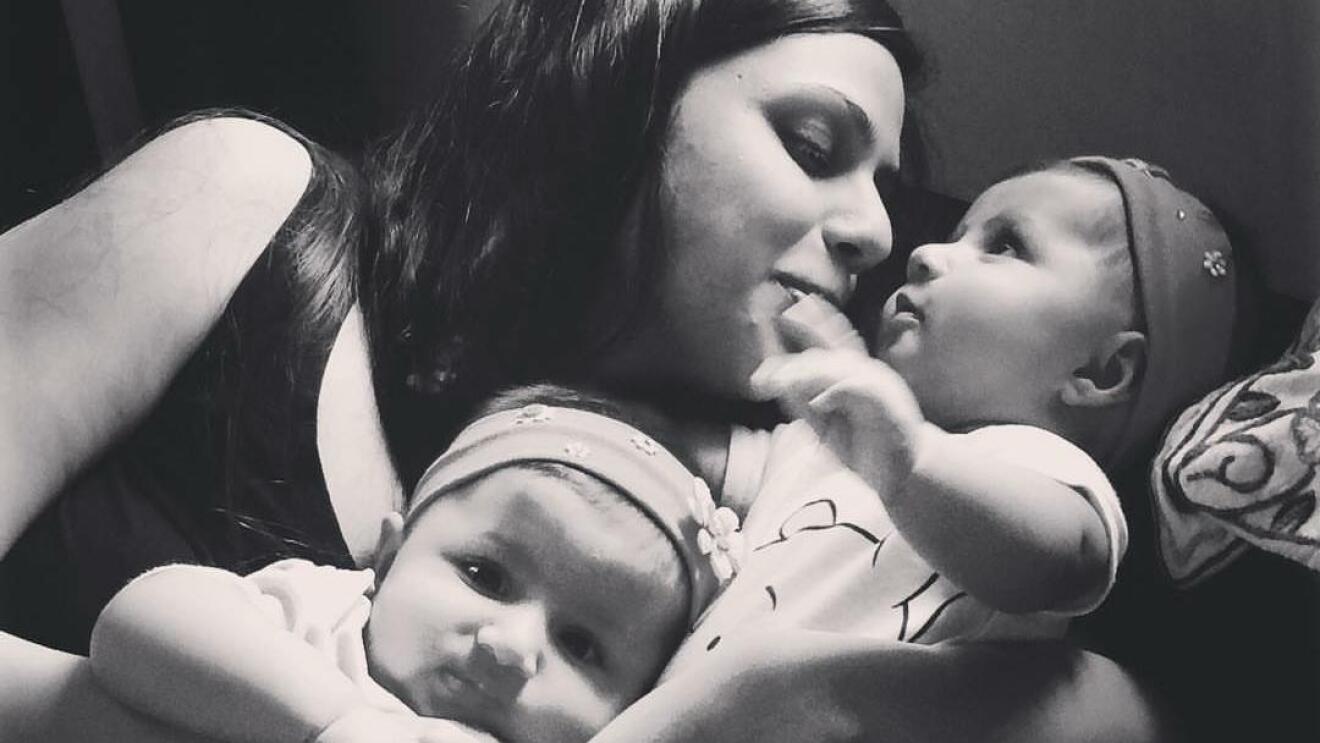 In the picture, Maliha is cuddling her two babies