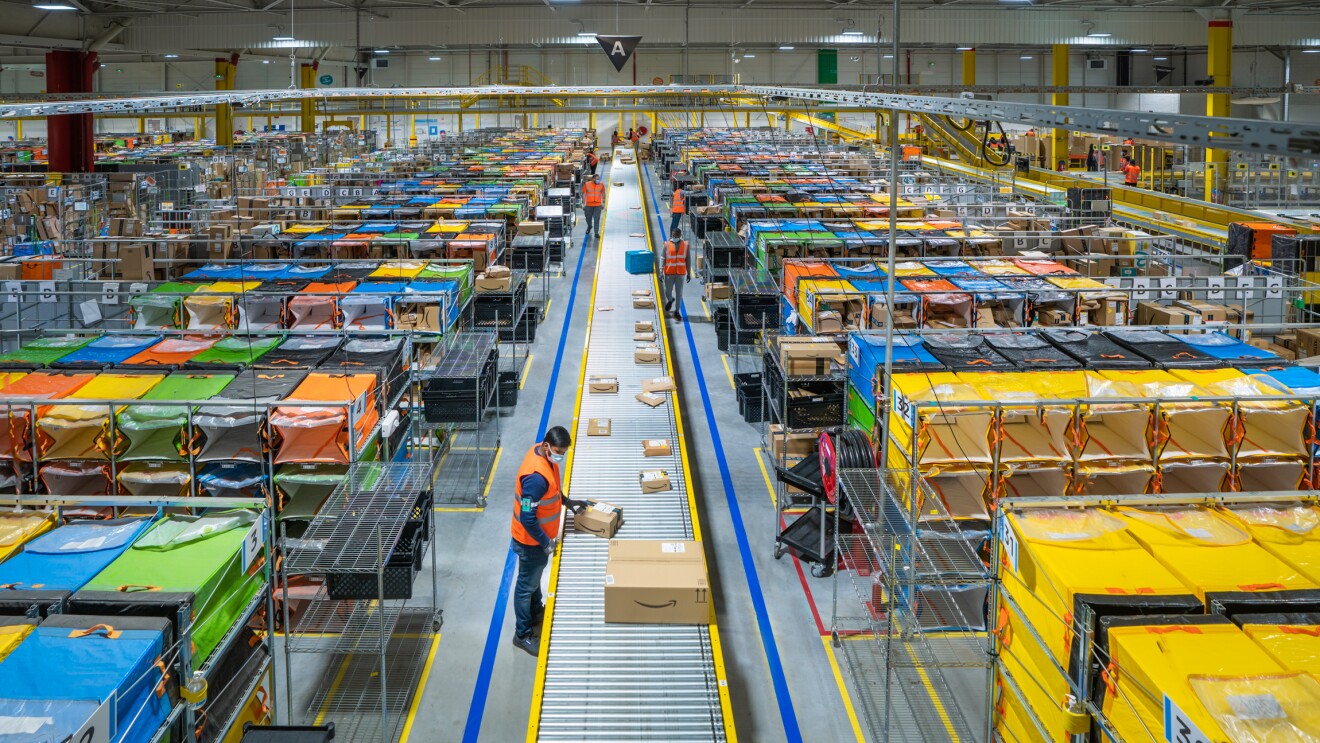 Photos of Amazon associates working in a Fulfillment Center in France.