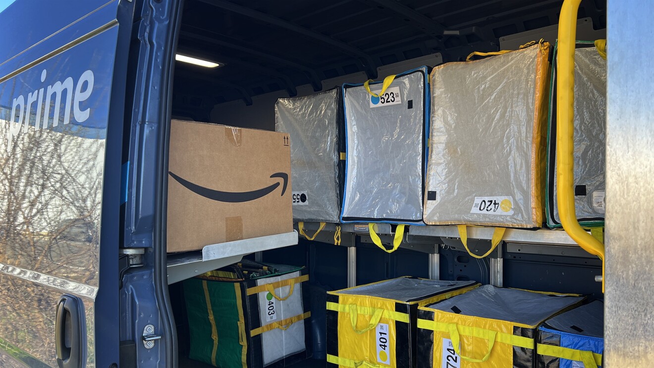 The inside of the back of an Amazon delivery vehicle where deliveries are stored.