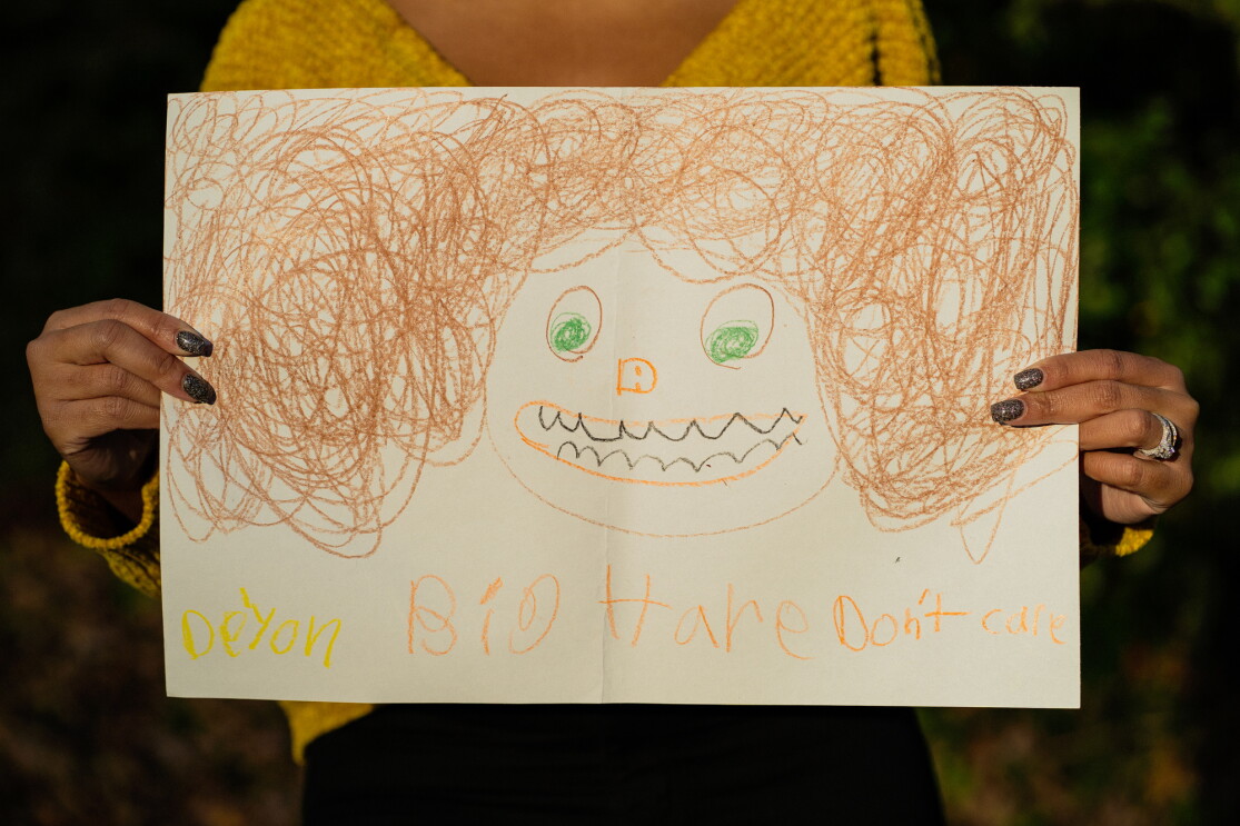 Self portraits of students shared with Crystal Swain-Bates after she participated in a book reading at a school.