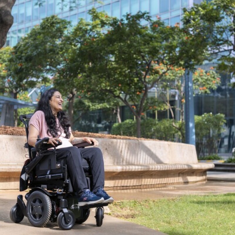 Mrunmaiy Abroal, a PR Manager on the Devices team in India and President of the PWD India Affinity group, smiles for a photo outside of the Amazon building in Bangalore, India. 