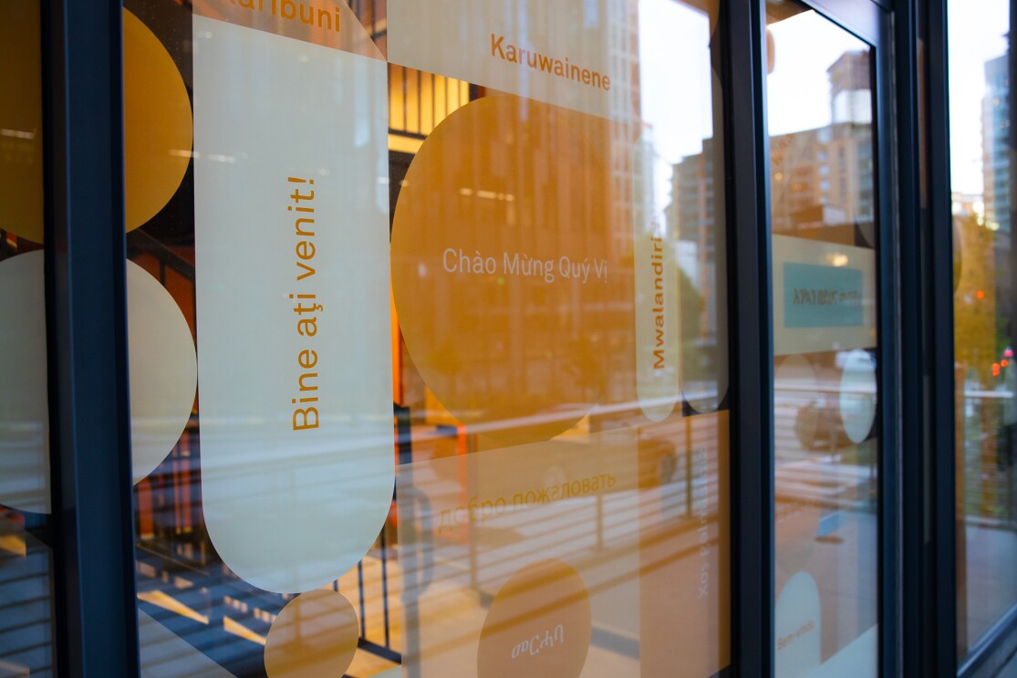 Mary's Place Family Center in The Regrade front entrance welcomes families in a wide variety of languages.
