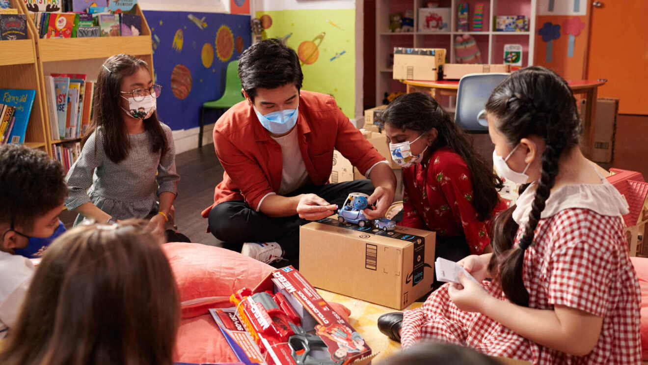 Nathan Hartono interacts with children from Club Rainbow Singapore