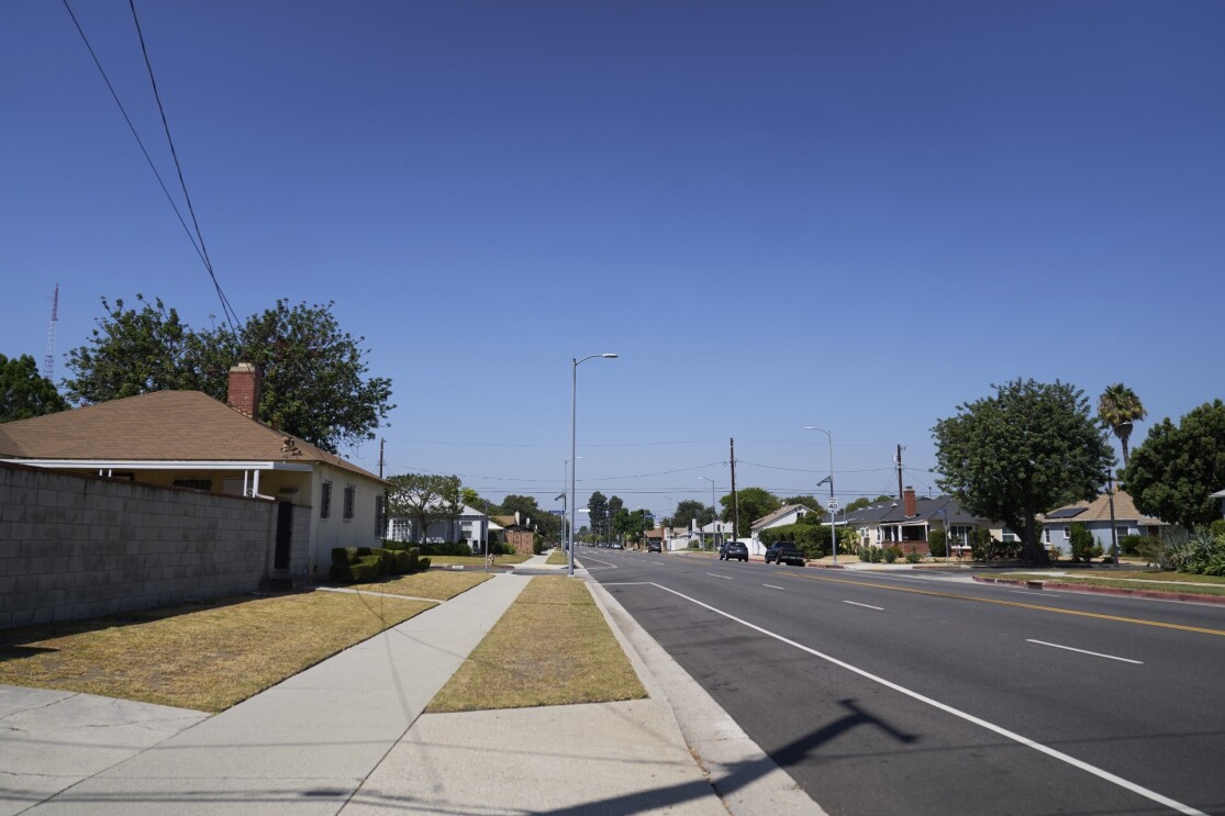 An empty street in a neighborhood.