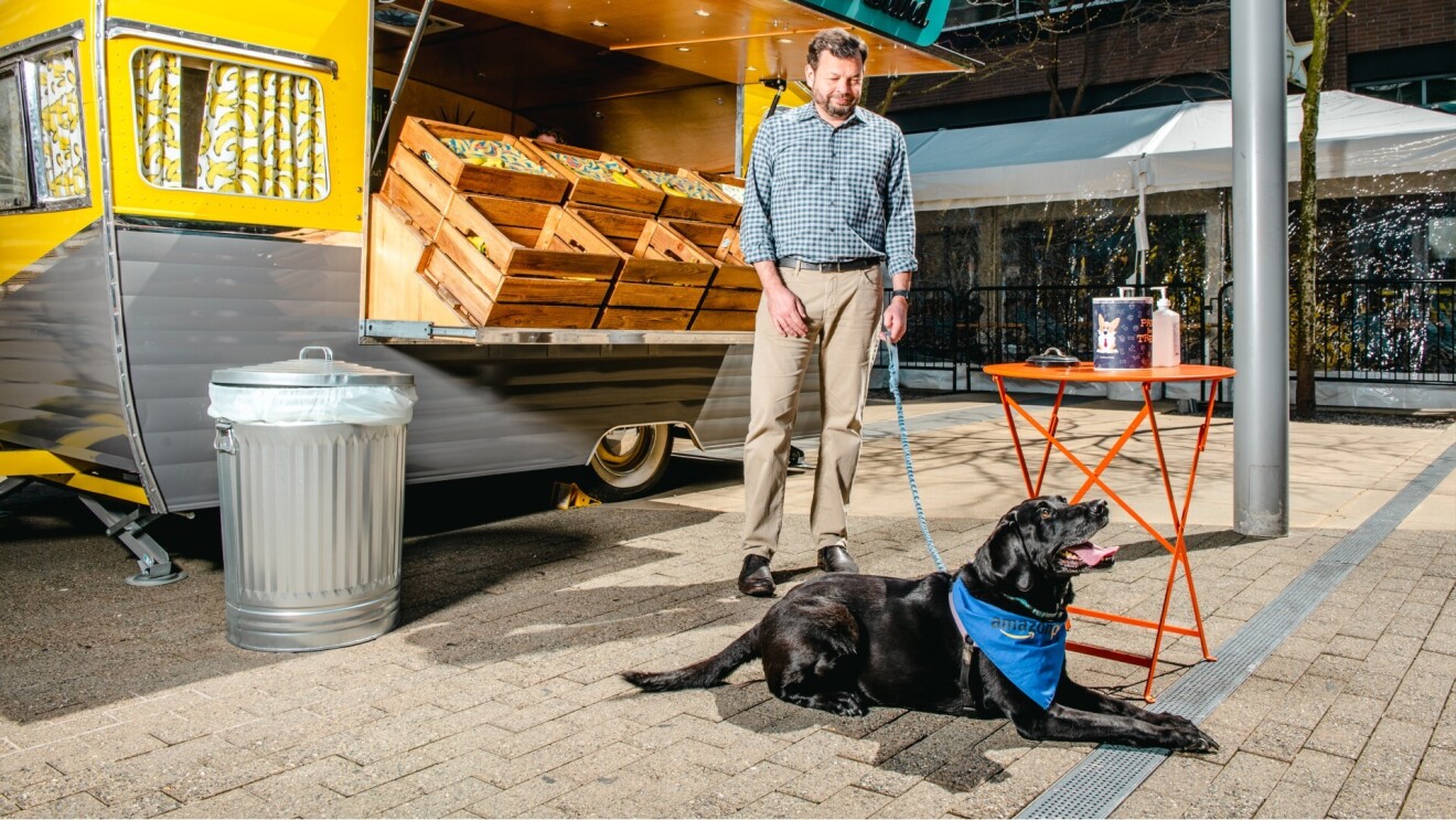 Chris and Sadie hang outside by the banana stand at Amazon's headquarters.